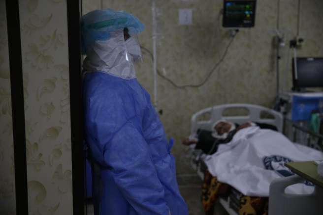 ‘A doctor in a quarantine centre, showing how tired he is after a long shift caring for Coronavirus patients. My thanks go out to all the doctors in the world standing as the first line of defence during this pandemic.’