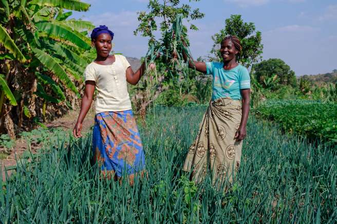 Two women showing off their latest crop