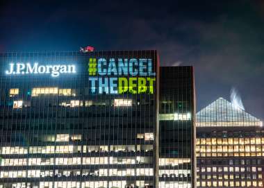 Images from the projection stunt from the Cancel the Debt campaign.